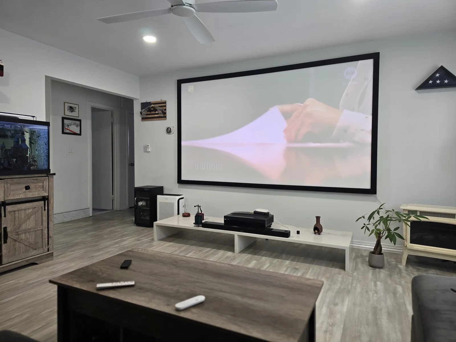 Home theater installation — projector and ceiling speakers in a living room