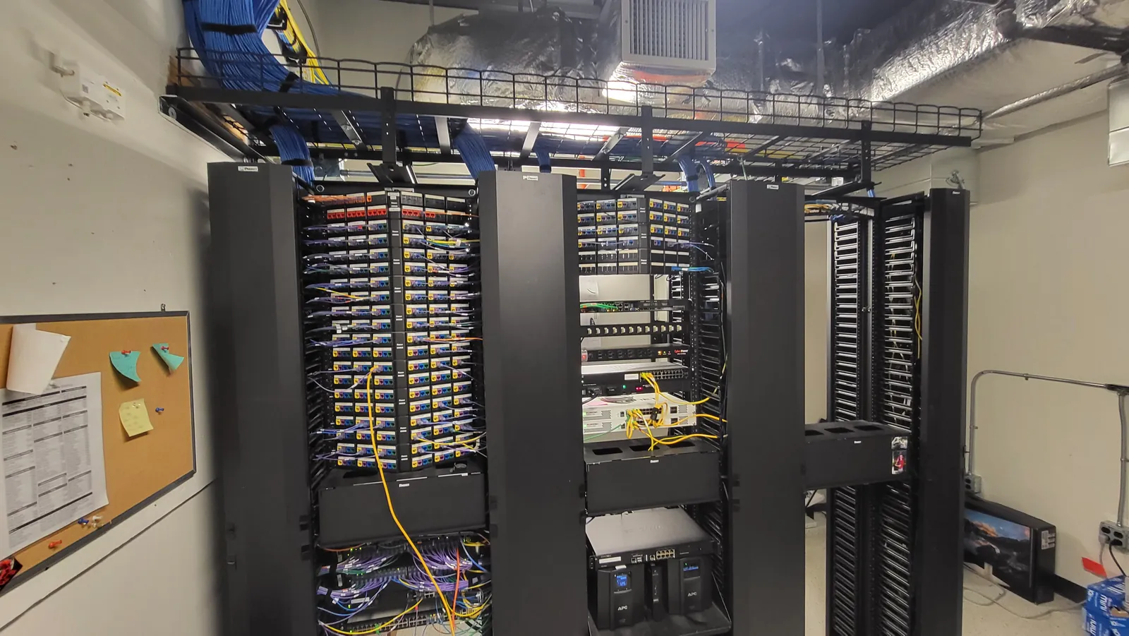 Server room with multiple network racks installed by KConnect Tech